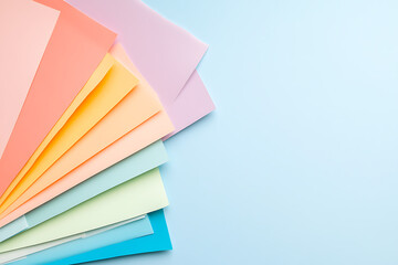 Poster - Pastel Paper Palette: A vibrant assortment of colorful papers arranged in a spectrum, ideal for creative projects and inspiring design.