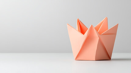Aufkleber - Intricate peach origami crown with pointed edges, showcasing creative paper folding and design against a soft backdrop.