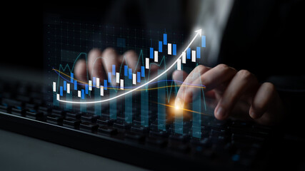 Poster - A business professional analyzes financial data using stock market graphs on a computer keyboard in a modern office, reflecting trends and growth strategies. Impute