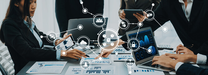 Poster - Engaging business meeting showcasing professionals using digital tools for data analysis and collaborative efforts within a contemporary office setting. Amity