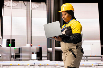 Poster - Professional engineer uses digital interface to supervise automated factory. The industry 4.0 system, features robotic arms and assembly lines, drives efficiency across modern industrial production.