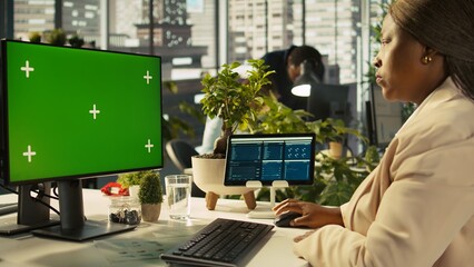 Poster - Office clerk working on green screen mockup PC to hit key performance targets for revenue and profitability. Employee at chroma key computer desk doing research analysis, camera B