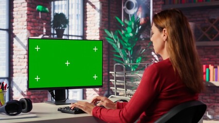Poster - Confident woman solves freelancing tasks at copy space desktop, browsing the internet pages at her home office. Mature focused person self employed doing her job remotely. Camera A.
