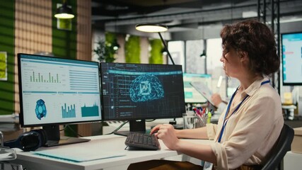 Poster - Woman employee using AI machine learning for efficiency recognition, using a synergy of data sharing and optimization models in a co working space. IT company artificial intelligence. Camera A.