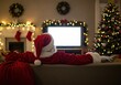 © Selda - Santa Claus enjoys some time off on Christmas eve, relaxing and watching tv.