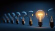 © SUYATI - Unique light bulb shines brightest among many others in a dark setting to symbolize innovation and ideas