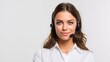 © Thidaphon - Young brunette woman in business shirt and headset, speaking naturally, looking at camera, clean composition with copy space, fully isolated on white background