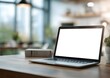 © MDRAFIQUL - Modern laptop with blank white screen on wooden desk in cozy home office, perfect for remote work, freelance, workspace, and technology concepts.