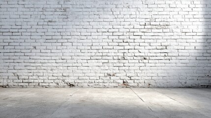 Poster - An empty industrial space features a white brick wall and a smooth concrete floor, illuminated by soft natural light coming from above, creating a serene atmosphere.