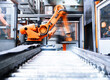 © BusinessClass by W61 - Blurred motion of robotic arm in factory