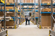 © BusinessClass by W61 - Businessmen standing and planning in warehouse
