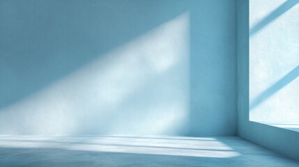 Poster - A serene interior space features soft blue walls and a large window. Natural light streams in, casting gentle shadows on the floor, enhancing the tranquil atmosphere.