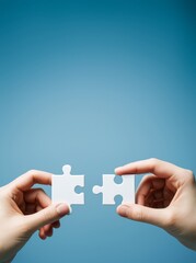 Poster - Two hands holding matching puzzle pieces on blue background symbolizing teamwork, connection, and collaboration in business concept.