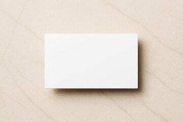 Poster - Minimal white blank business card on marble background for branding or promotional mockup template with clean copyspace concept design setup.