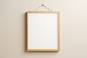Poster - Minimalist wooden frame hanging on beige wall with blank white poster for mockup or branding design template presentation concept.