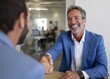 © Ganesha88 - Business meeting happy businessman shaking hands office environment professional interaction