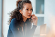 © BusinessClass by W61 - Customer service representative with curly hair talking through headset