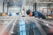 © BusinessClass by W61 - Engineer wearing hardhat analyzing machinery in industry