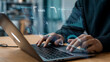 © Atiour - Futuristic AI Technology Interface Businessman Analyzing Data on Holographic Display with Laptop