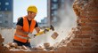 © Pixel Stone - Construction worker demolishing brick wall with sledgehammer during building renovation project