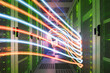 © BusinessClass by W61 - Colorful network waves traveling in server room of data center