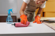 © crizzystudio - Cleaning service wiping desk with microfiber cloth and disinfectant spray