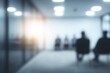 © Arif - Blurred silhouettes of business people in a modern office corridor. Soft blue gray tones and glass walls create depth. Conveys uncertainty and transition. Ideal for corporate strategy slides.