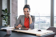 © BusinessClass by W61 - Happy businesswoman with hand on chin at work place