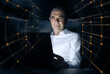 © BusinessClass by W61 - Businessman using laptop amidst illuminated dots at office