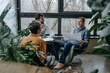 © BusinessClass by W61 - Happy business people having discussion in office