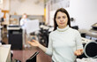 © JackF - Friendly print shop employee invites a customer to come inside