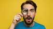 © NIC - Man with surprised expression looking through a magnifying glass, eye enlarged, against a yellow background.