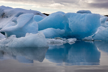 Wall Mural - beautiful blue icebergs reflected in the jokulsarlon glacial lagoon, southern iceland. part of the v