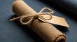 © MST - A Rustic Burlap Scroll Tied With Twine and a Blank Tag