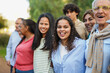© Sabrina - Crowd of multiracial people smiling in front of camera at city park - Community, social inclusion and diversity concept