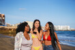 © Sabrina - Group of multiracial young women having fun together on the beach during summer vacation - Female friendship, diversity and travel concept