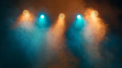Wall Mural - stage lights with blue and orange beams cutting through smoky darkness.