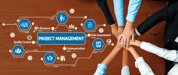 Poster - This image showcases a collaborative approach to project management, featuring diverse hands joining over a workflow diagram on a wooden desk, symbolizing teamwork and communication. Amity