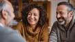 © Johannes - Happy mature couple discussing investments with financial broker during meeting at home. Middle eastern man and woman discussing about financial planning with consultant at home. Financial consultant
