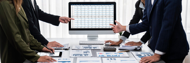 Poster - Panorama shot analyst team utilizing BI Fintech to analyze financial report with laptop. Businesspeople analyzing BI data dashboard displayed on laptop screen for business insight. Prodigy