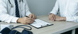 © Ngampol - Doctor consulting with the patient and checking sickness condition while presenting results diagnosis symptom examining about the problem of illness and recommend treatment method