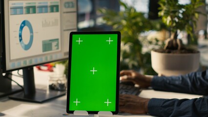 Poster - Close up of isolated screen tablet used by worker in office reviewing financial graphs. Employee looking over data trends and strategic insights on mockup tablet, analyzing KPIs, camera A