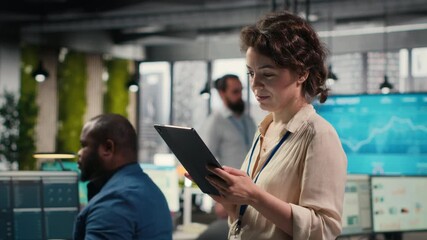 Poster - Woman business consultant examines charts and icons on tablet to create monthly reports, demonstrating effective management and strategic planning skills for work productivity. Camera B.