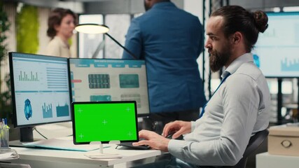 Poster - Professional male analyst examining KPI insights with mockup on tablet, showcasing strategic mindset to business development tactics. Supporting innovation and goals achievement. Camera B.