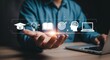 © Nilofar - A man at a laptop presents a holographic interface with a glowing row of icons for education and knowledge (graduation cap, lightbulb, book, etc.), symbolizing e-learning and personal development. Pho