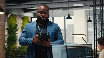 Poster - Black consultant leverages analytics and report writing for forecast results and corporate development, utilizing digital resources and insights for strategic alignment with goals. Camera B.