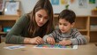© Ajigus - Woman and child working together on a colorful puzzle.