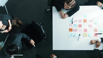 Poster - Top view of investor writing white board to present project and putting hand together with professional business team to celebrate successful project at meeting table with sticky note. Directorate.