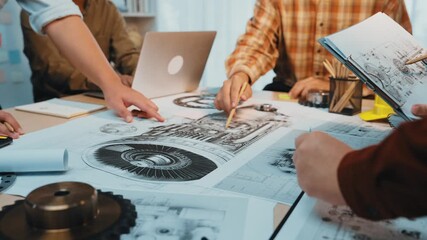 Poster - A diverse team of professionals engages in brainstorming and collaboration over detailed technical drawings in a modern office, showcasing creativity and innovation. SACTR