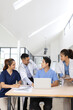 © SOMKID - Medical team brainstorming having a meeting in conference room at hospital, Medical technology and health care concept.
